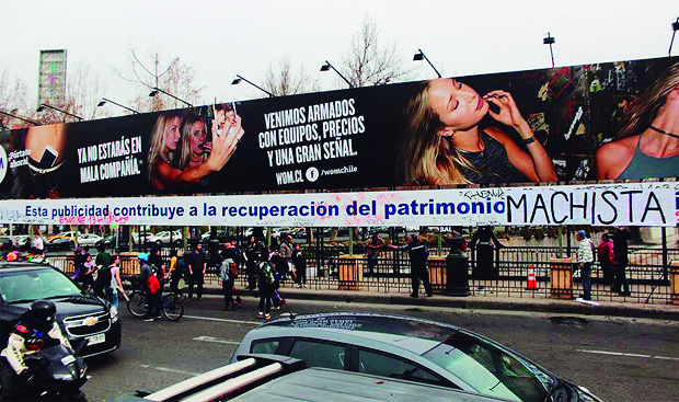 Intervención a publicidad de WOM, puente Pio Nono. Acción realizada por la Brigada Feminista. Julio 2015. 